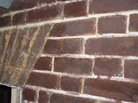decayed brickwork, before restoration